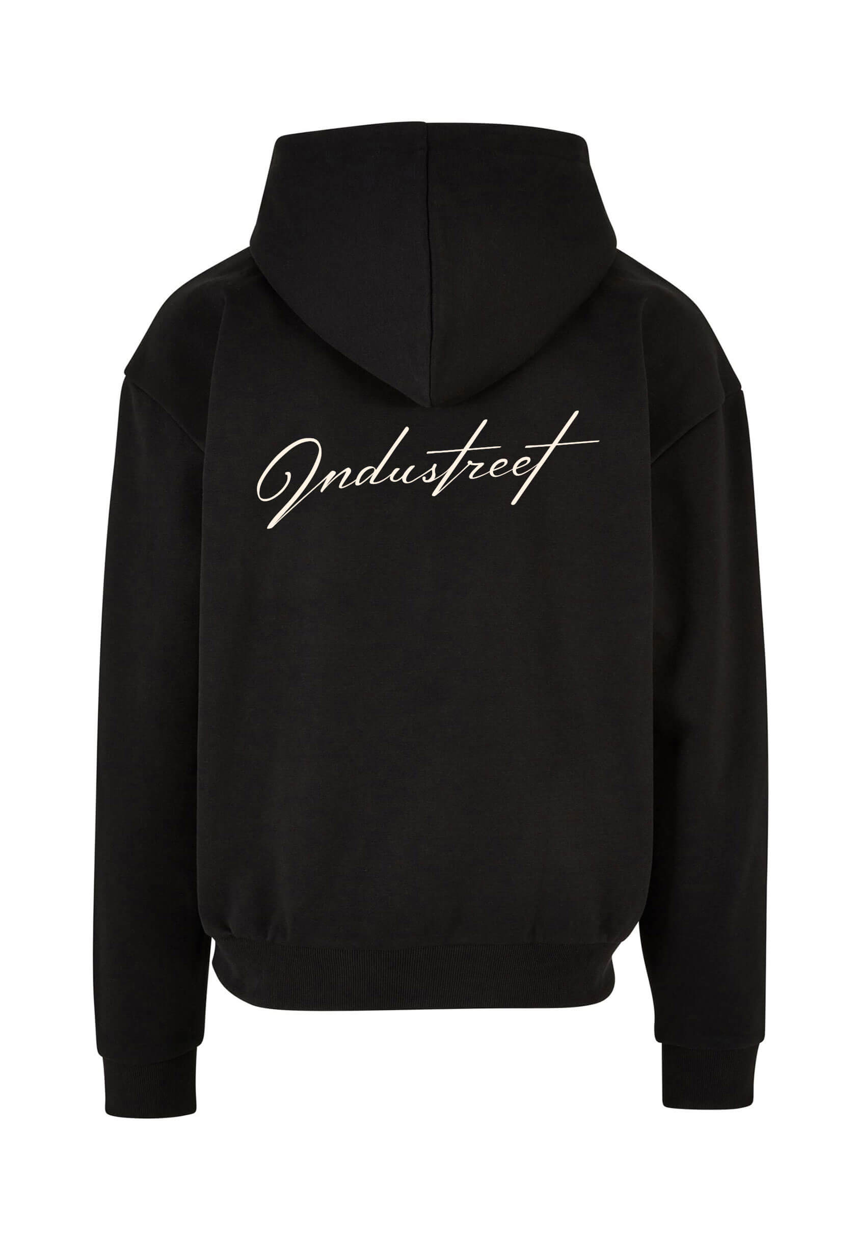 Dos du pull broderie premium noir, matière épaisse et chaude.